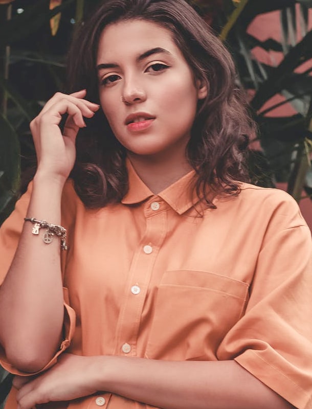 Woman with peach-color shirt